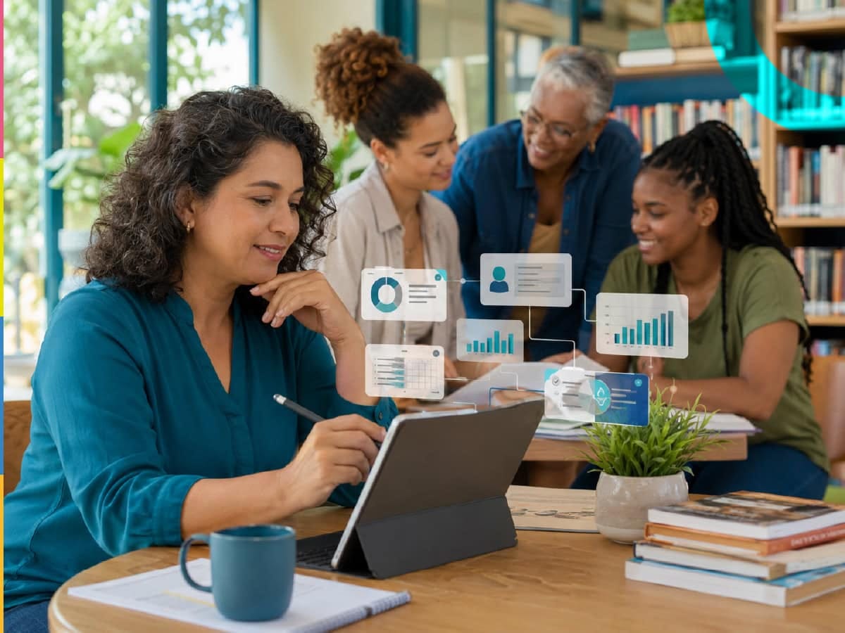 Grupo de gestoras escolares em uma reunião de trabalho com tecnologia e gráficos digitais da DEia – Diário Escola inteligência aplicada.